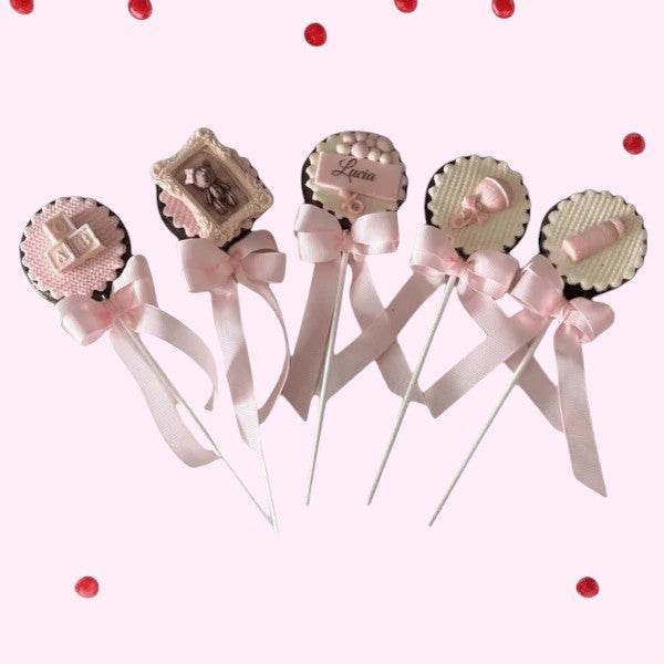 Sweet Snap Sydney baby shower chocolate lollies with pink bows, featuring teddy bear, ABC blocks, and baby bottle designs.