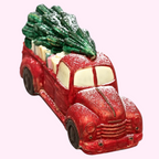 Sweet Snap Sydney handcrafted red chocolate truck carrying a Christmas tree and gifts with a dusting of sugar snow.