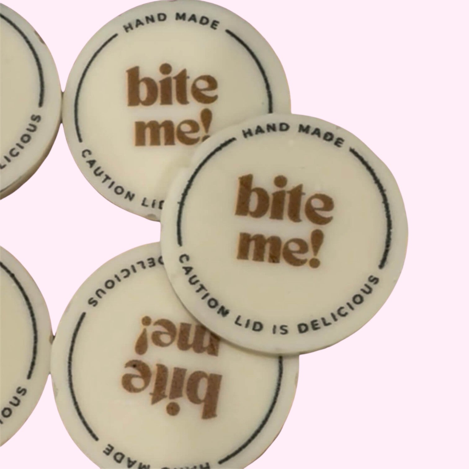 Sweet Snap Sydney white chocolate discs with 'bite me!' text and 'hand made' border detail.