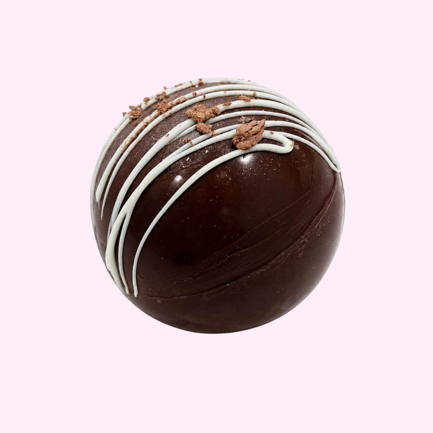 Sweet Snap Sydney dark chocolate hot chocolate bomb with white chocolate drizzle and chocolate shavings.