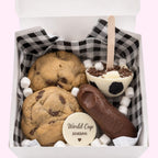 Sweet Snap Sydney Soccer Hot Chocolate Bomb gift box with 2 chocolate chip cookies, a soccer ball hot chocolate bomb, and a chocolate shoe.
