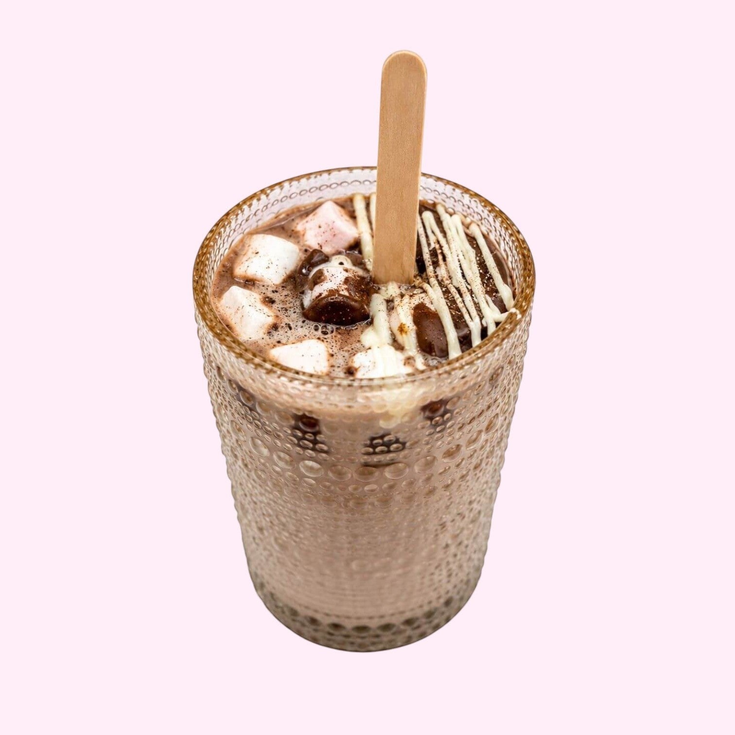 Sweet Snap Sydney hot chocolate bomb dissolving in a glass with marshmallows and white chocolate drizzle.