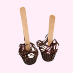 Sweet Snap Sydney hot chocolate bombs with marshmallows and chocolate drizzle on wooden sticks.