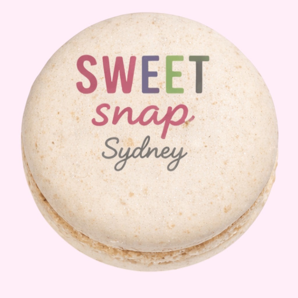 Sweet Snap Sydney beige macaron with colourful logo text, ideal for corporate events and gifts.