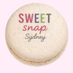 Sweet Snap Sydney beige macaron with colourful logo text, ideal for corporate events and gifts.