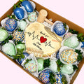 Sweet Snap Sydney chocolate-covered strawberries and heart-shaped cookie with medical theme, blue, green, and yellow.