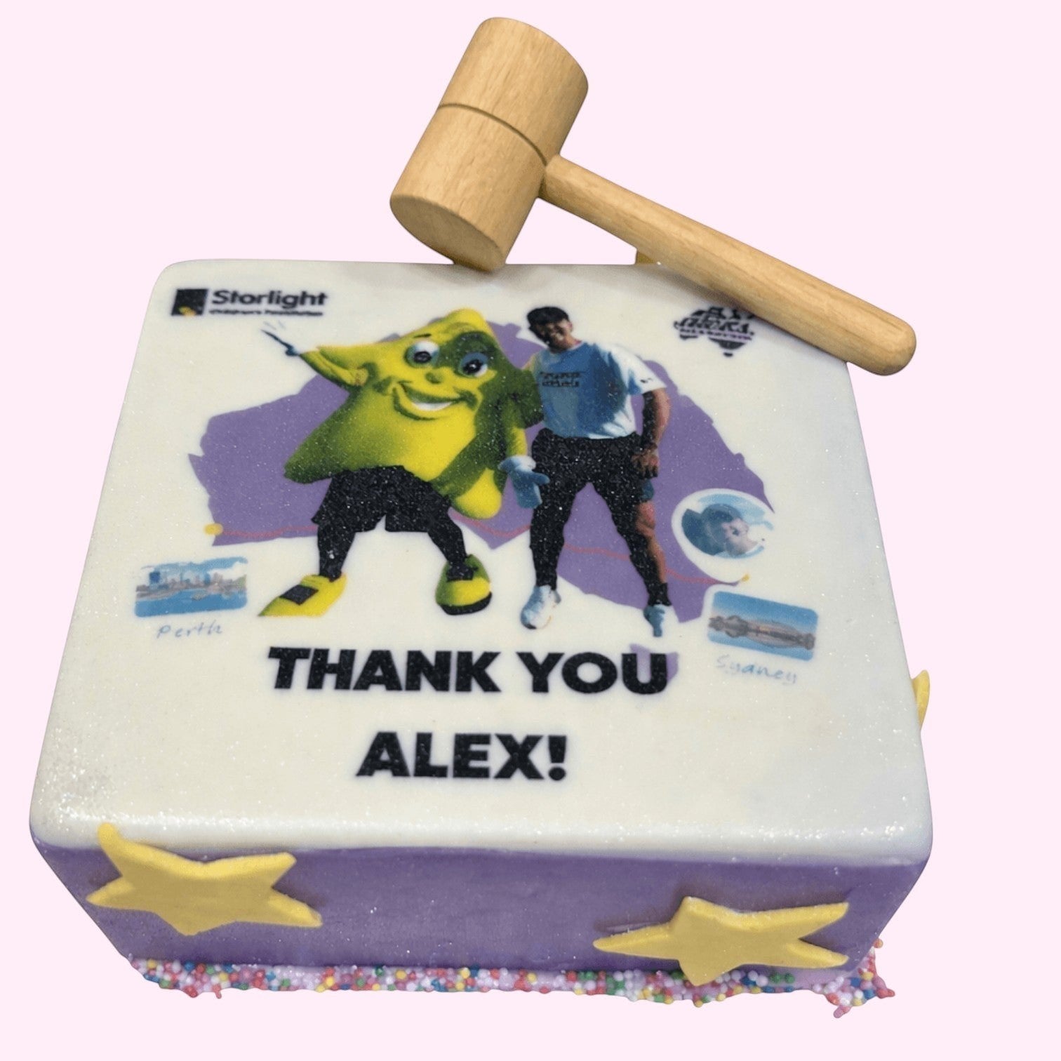 Sweet Snap Sydney square cake with 'Thank You Alex!' text, Starlight logo, cartoon character, and a man. Includes a wooden mallet.