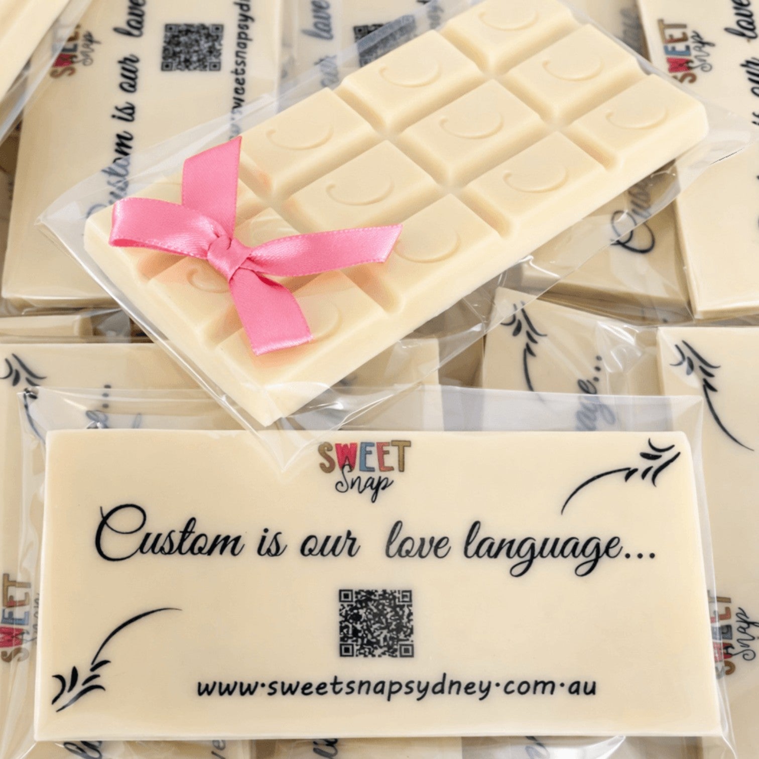 Sweet Snap Sydney white chocolate bar with custom illustration and pink ribbon, perfect for corporate gifting.