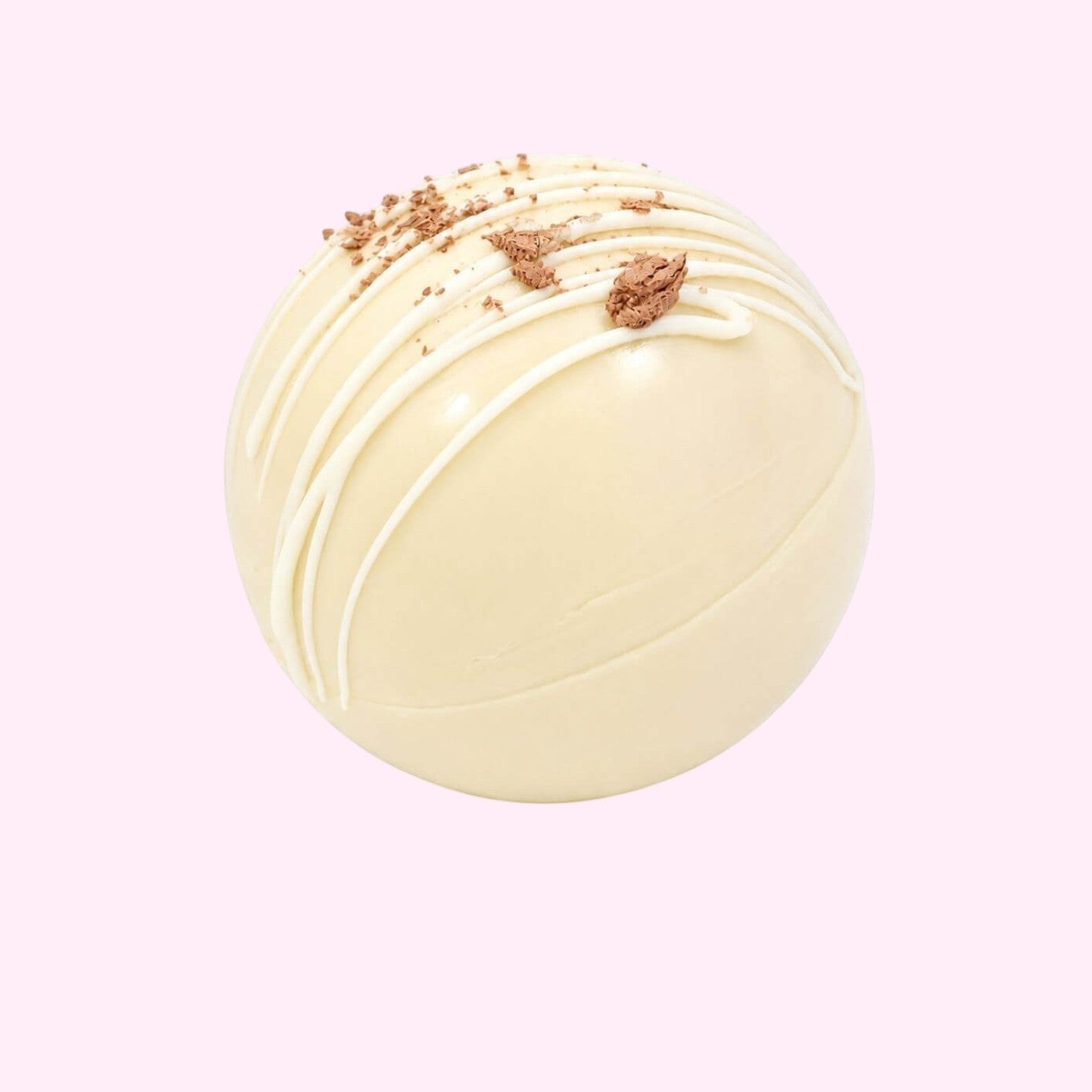 Sweet Snap Sydney white chocolate hot chocolate bomb drizzled with white chocolate and topped with chocolate shavings.