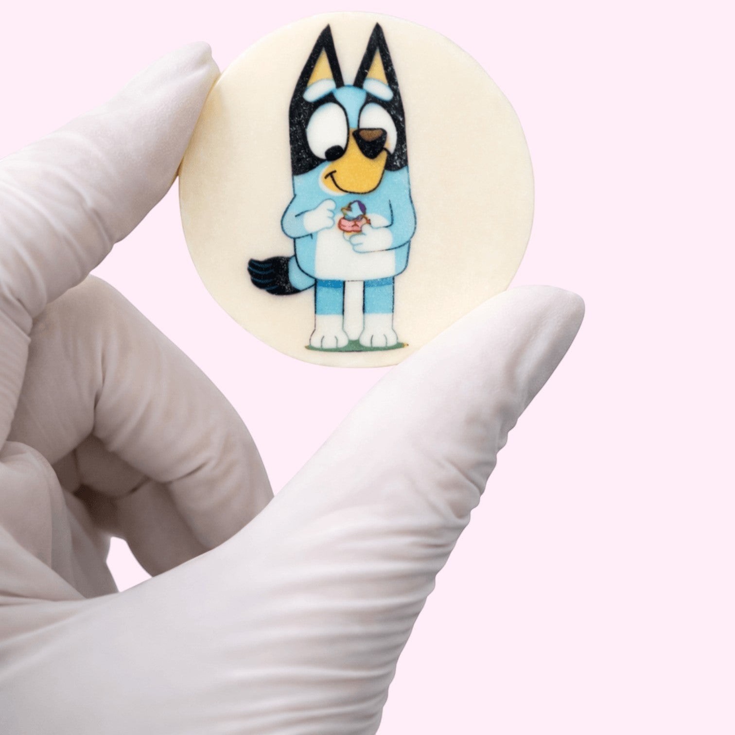 Sweet Snap Sydney customisable chocolate disc featuring Bluey character holding a cupcake.