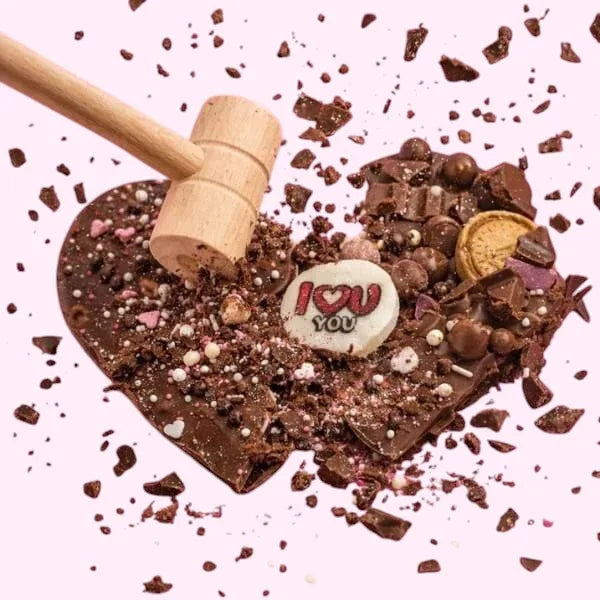 Sweet Snap Sydney Heartbreaker Chocolate Slab, a smashable heart made of chocolate with I Love You chocolate disc and assorted toppings.