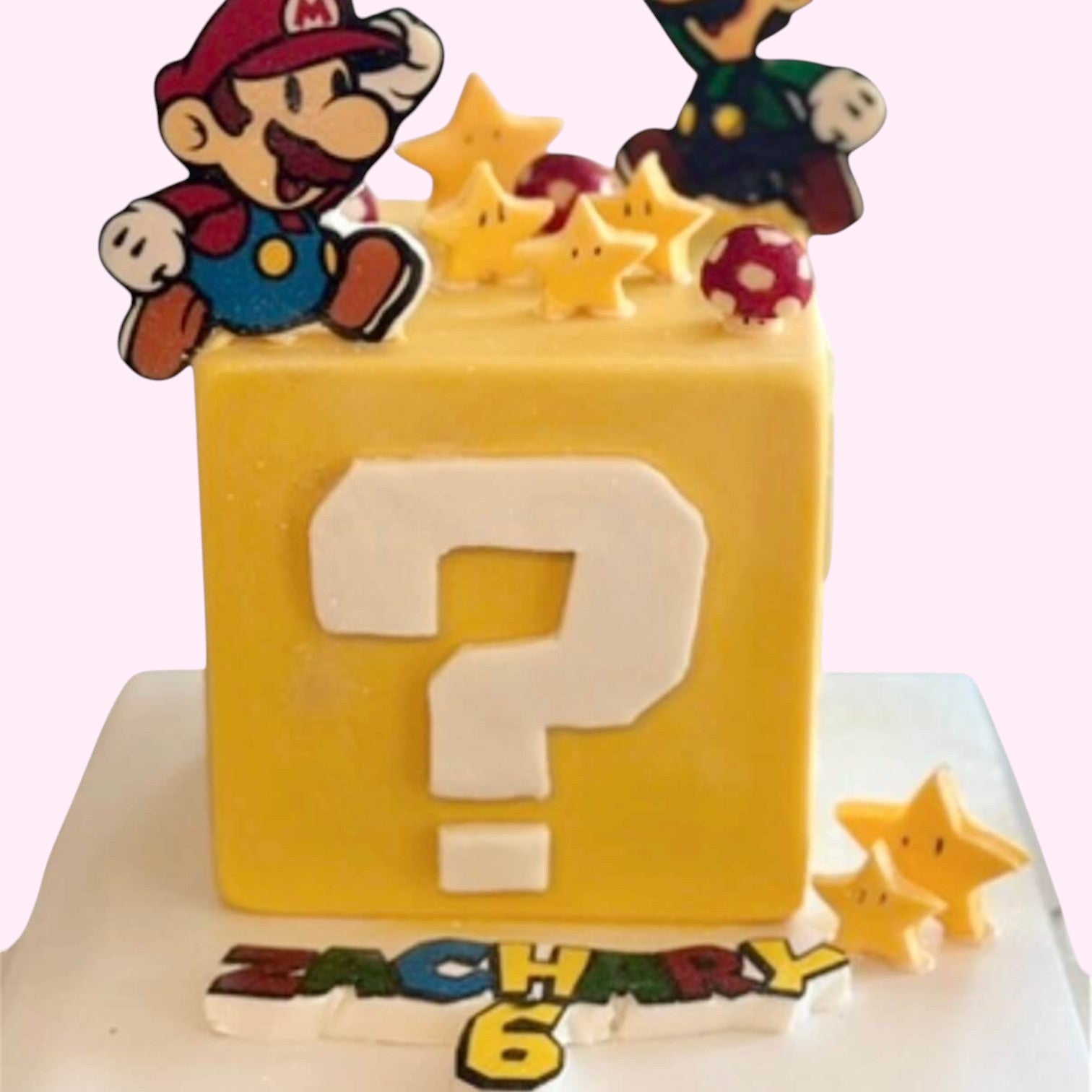 Sweet Snap Sydney Mario themed square smash cake with question block, Mario, Luigi, stars, and 'Zachary 6' personalisation.